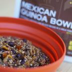 Red bowl filled with mexican quinoa dish in front of a pouch labeled 'Mexican Quinoa Bowl'.